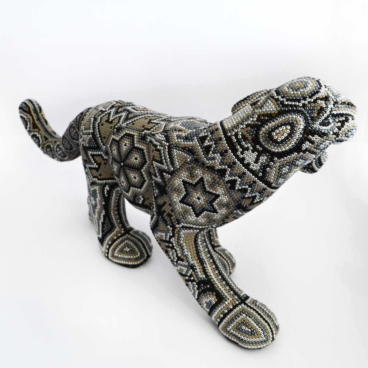 Jaguar caminado de arte huichol