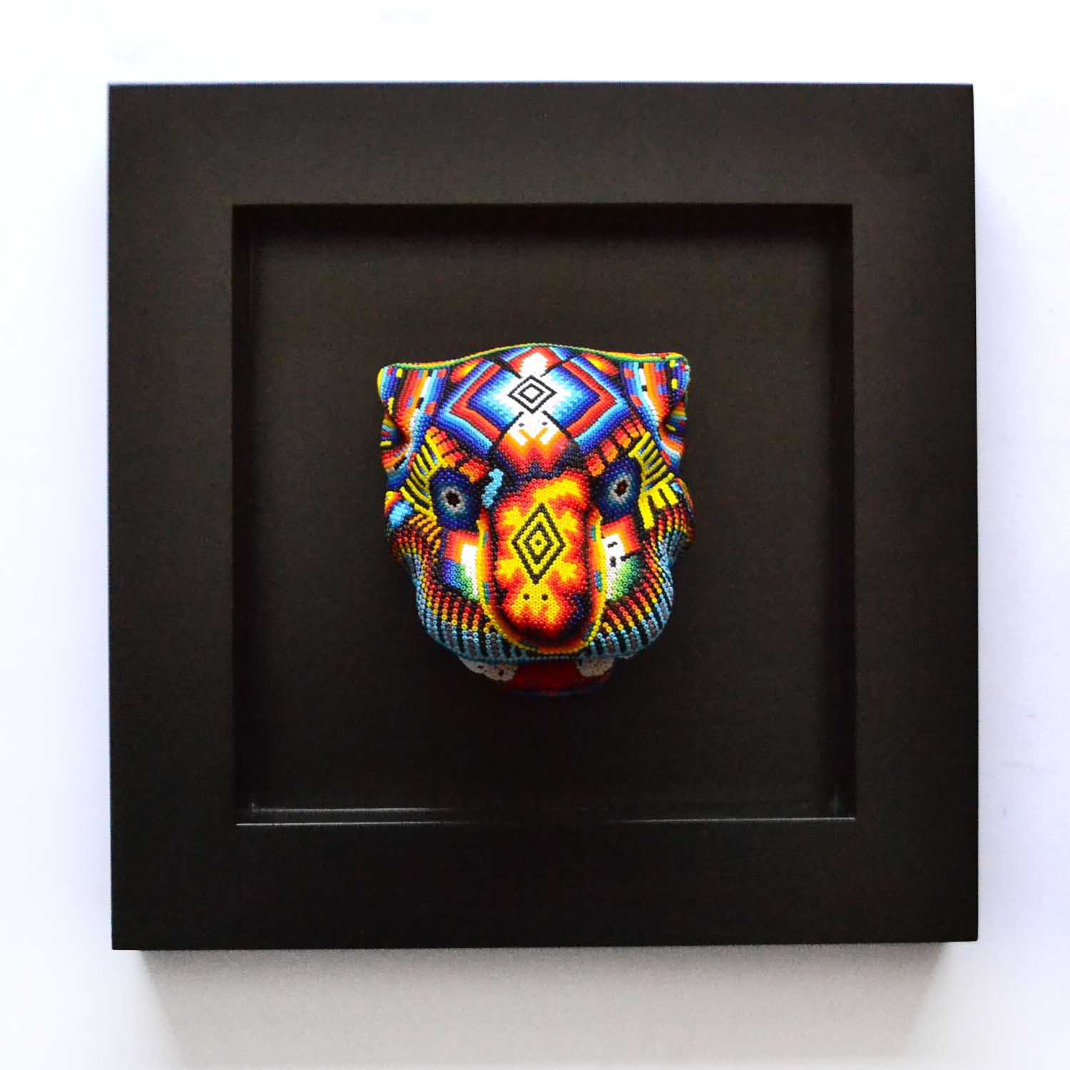 Cabeza de jaguar en marco - Arte Huichol